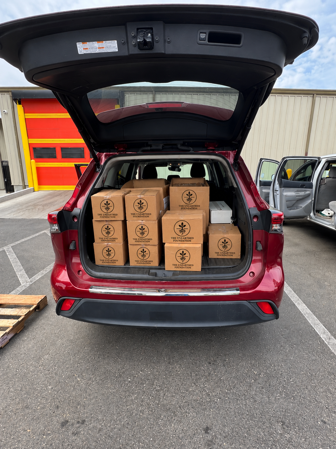 Unearthed Foundation food boxes loaded for the First Saturday community distribution