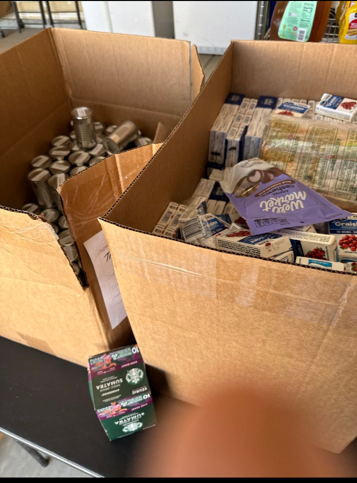 Boxes of food supplies prepared for First Saturday community distribution